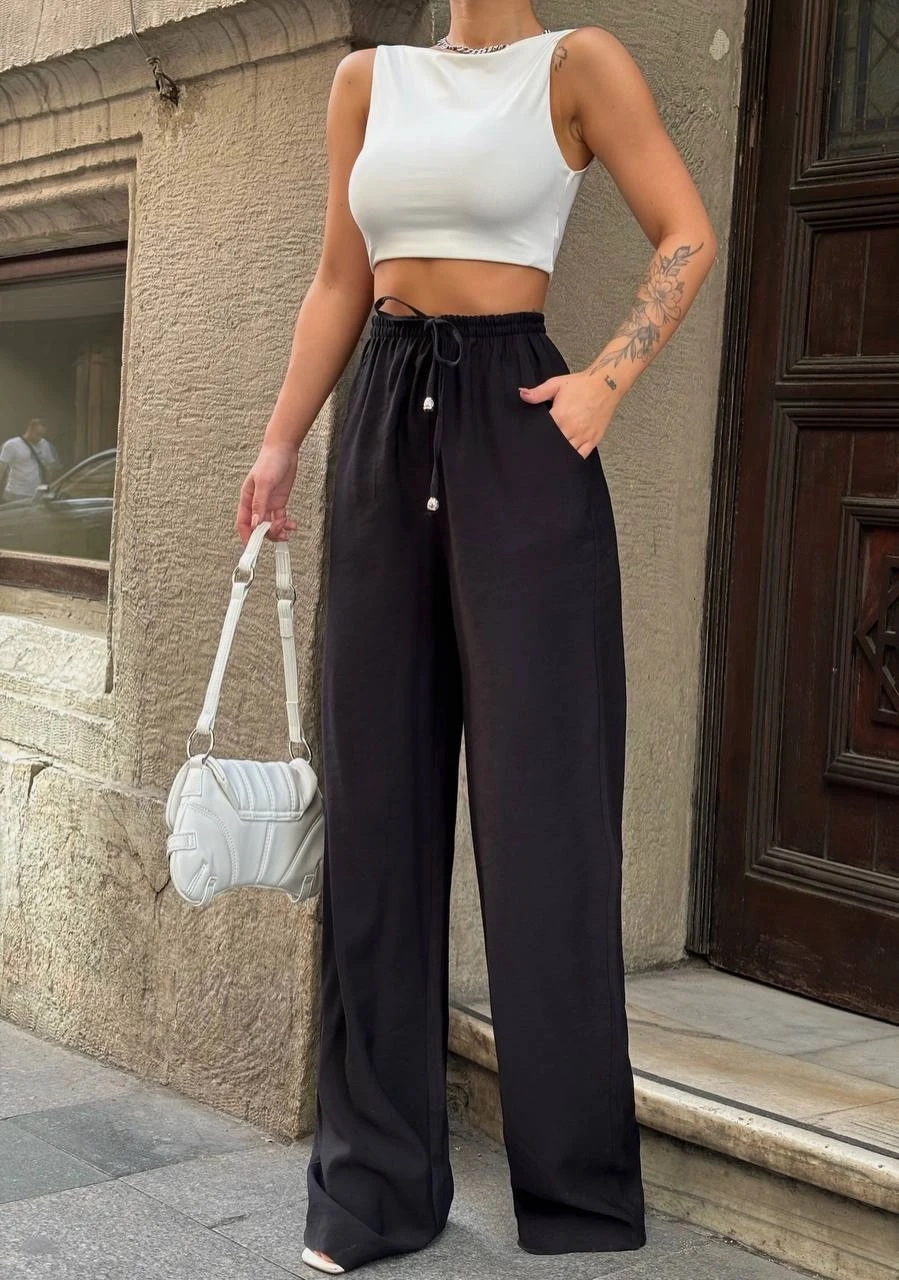 Kadın Siyah Yüksel Bel Lastikli Beli Bağlamalı Cepli Geniş Paça Pantolon HZL24S-VL191151